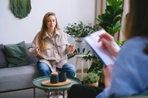 A person participating in a therapy session with a psychologist, highlighting mental health support in Bensalem, PA.